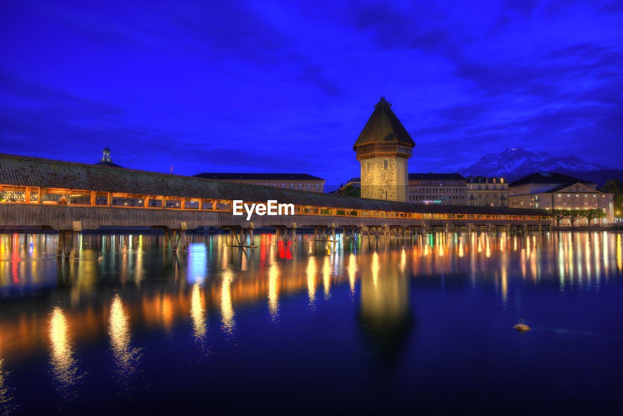 Reflection of illuminated buildings in water at night