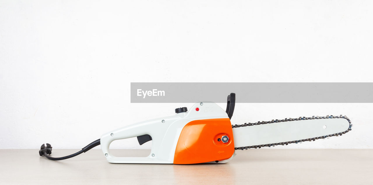 New electric saw on a white background with copy space