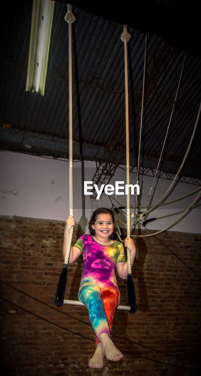 Smiling girl practicing gymnastics 