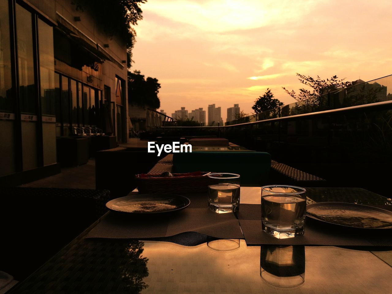 Restaurant place setting against moody sky