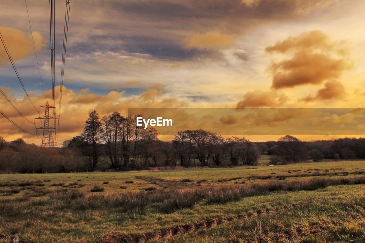 SCENIC VIEW OF LAND AGAINST SKY DURING SUNSET