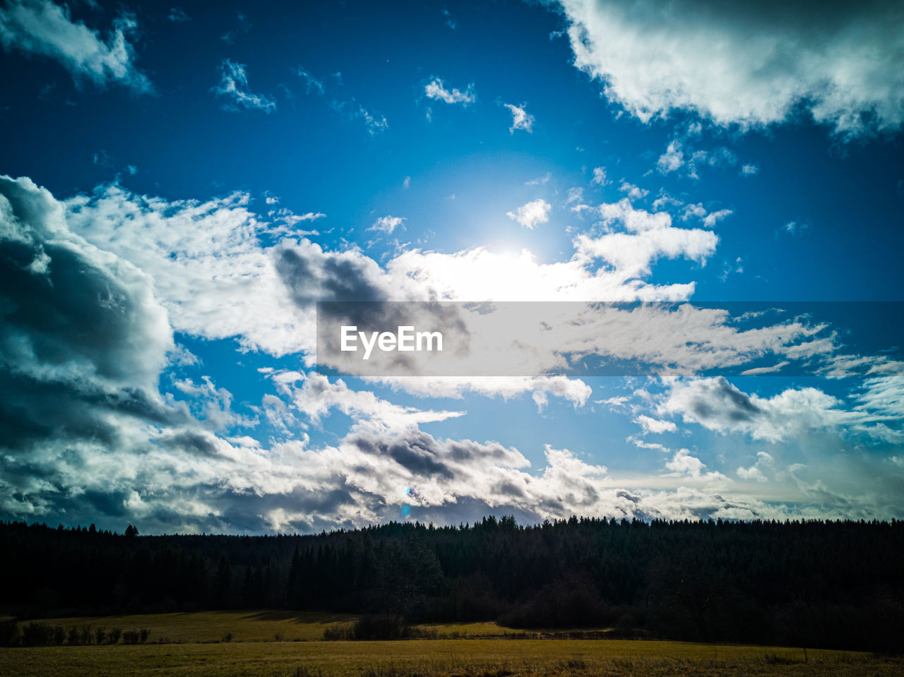 SCENIC VIEW OF LAND AGAINST BLUE SKY