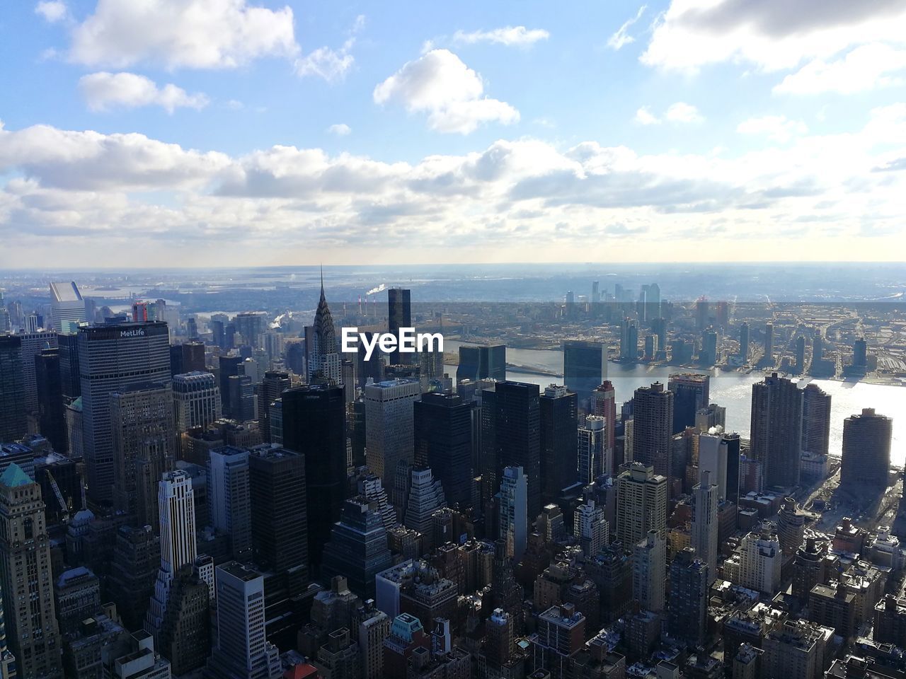 Aerial view of modern buildings in city against sky