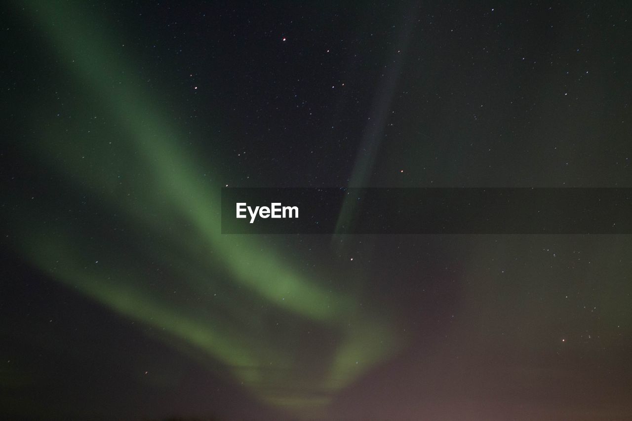 Low angle view of northern lights at night