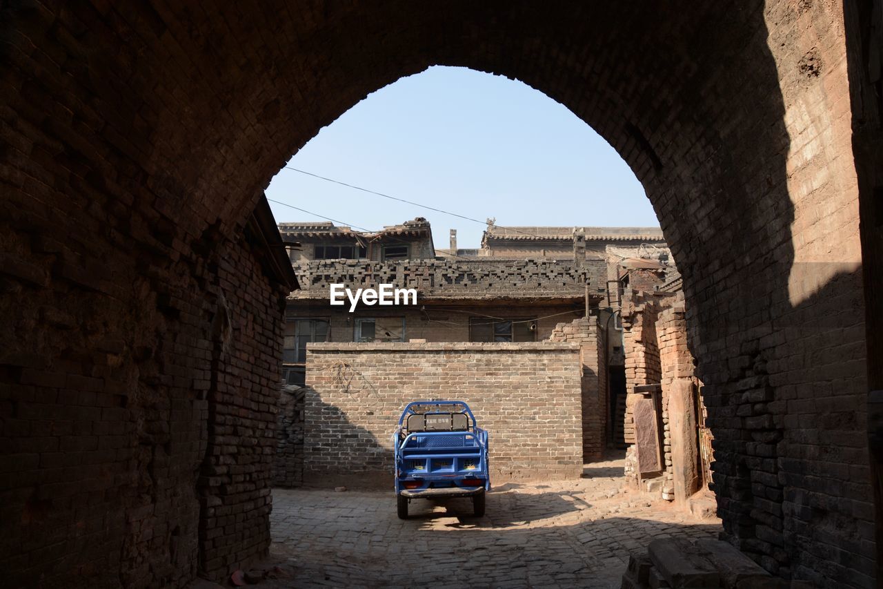 VIEW OF HISTORICAL BUILDING THROUGH WINDOW