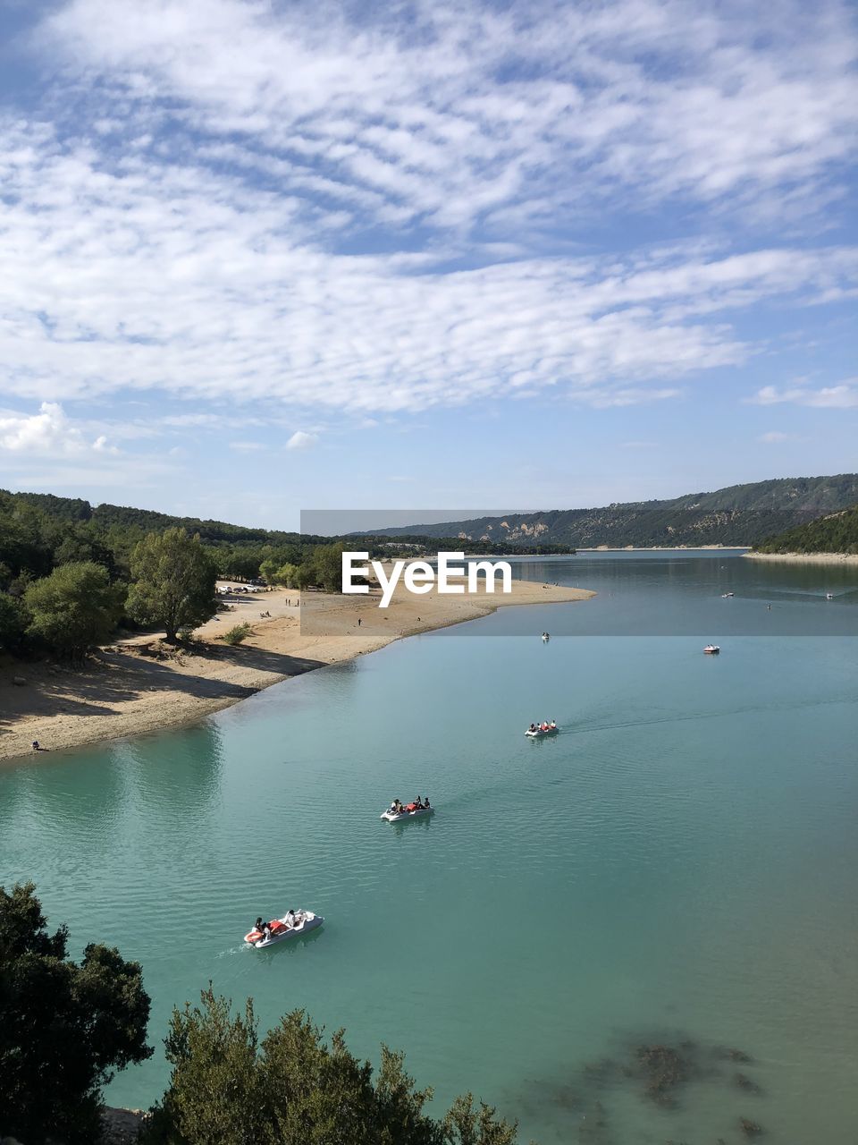 High angle view of sailboats in sea against sky