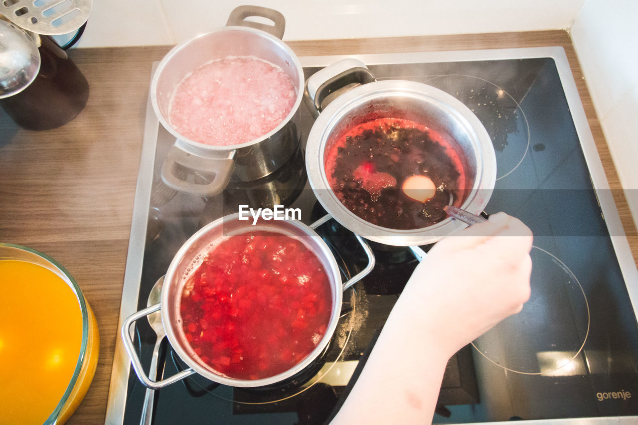 HIGH ANGLE VIEW OF PREPARING FOOD