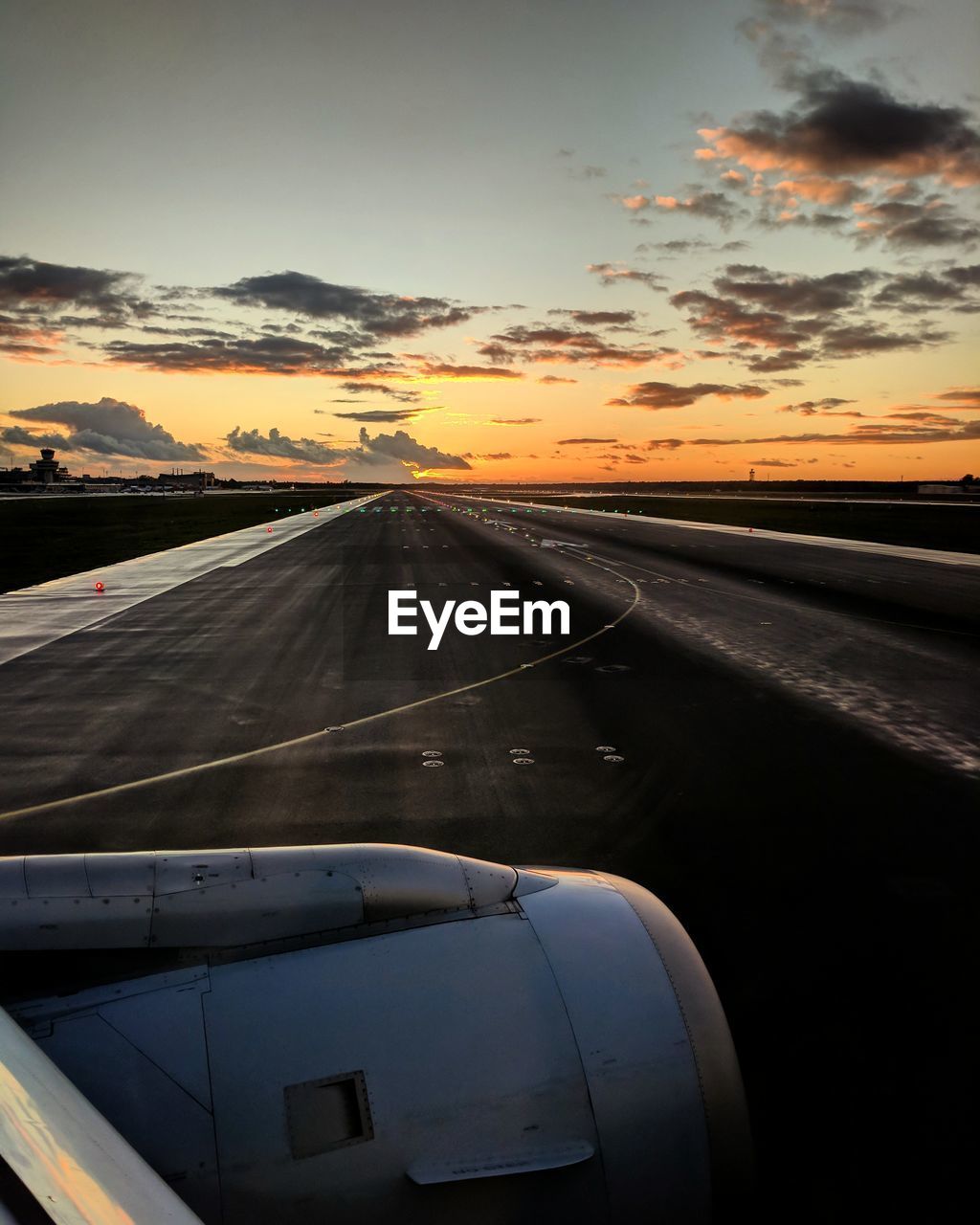 VIEW OF AIRPLANE WING AGAINST SKY