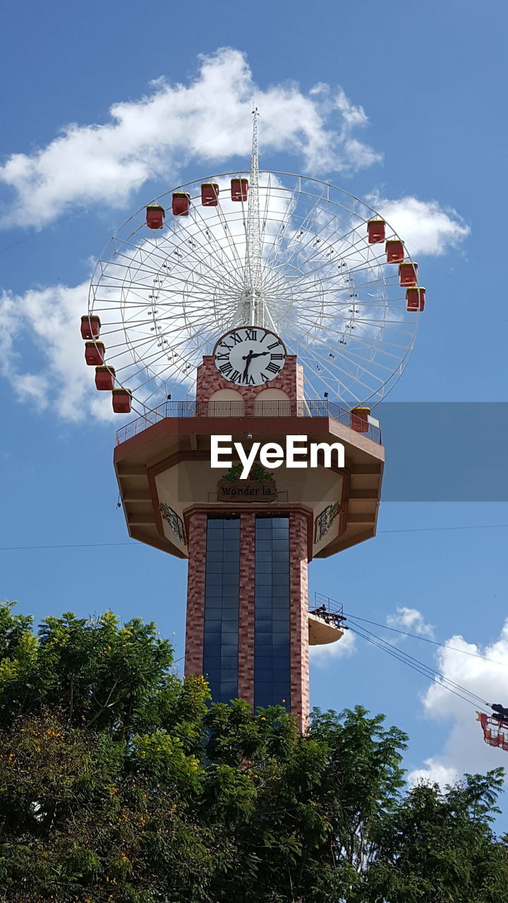 LOW ANGLE VIEW OF AMUSEMENT PARK AGAINST SKY