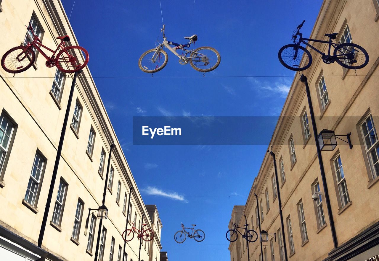 LOW ANGLE VIEW OF BICYCLE IN CITY