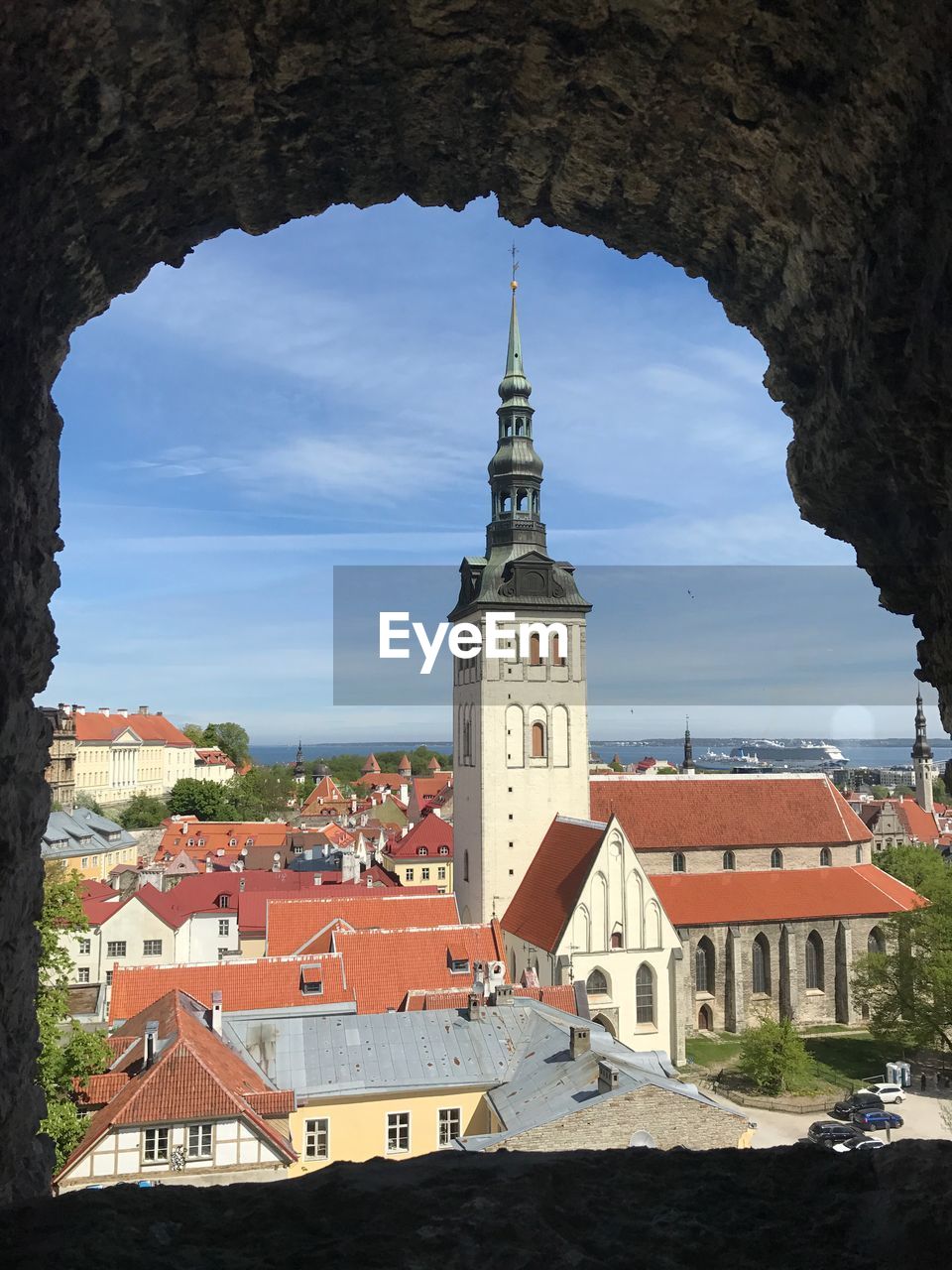 HIGH ANGLE VIEW OF CHURCH TOWER IN TOWN