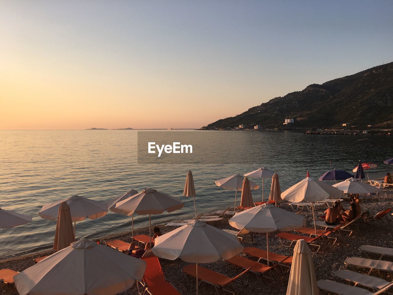 Scenic view of sea against clear sky during sunset