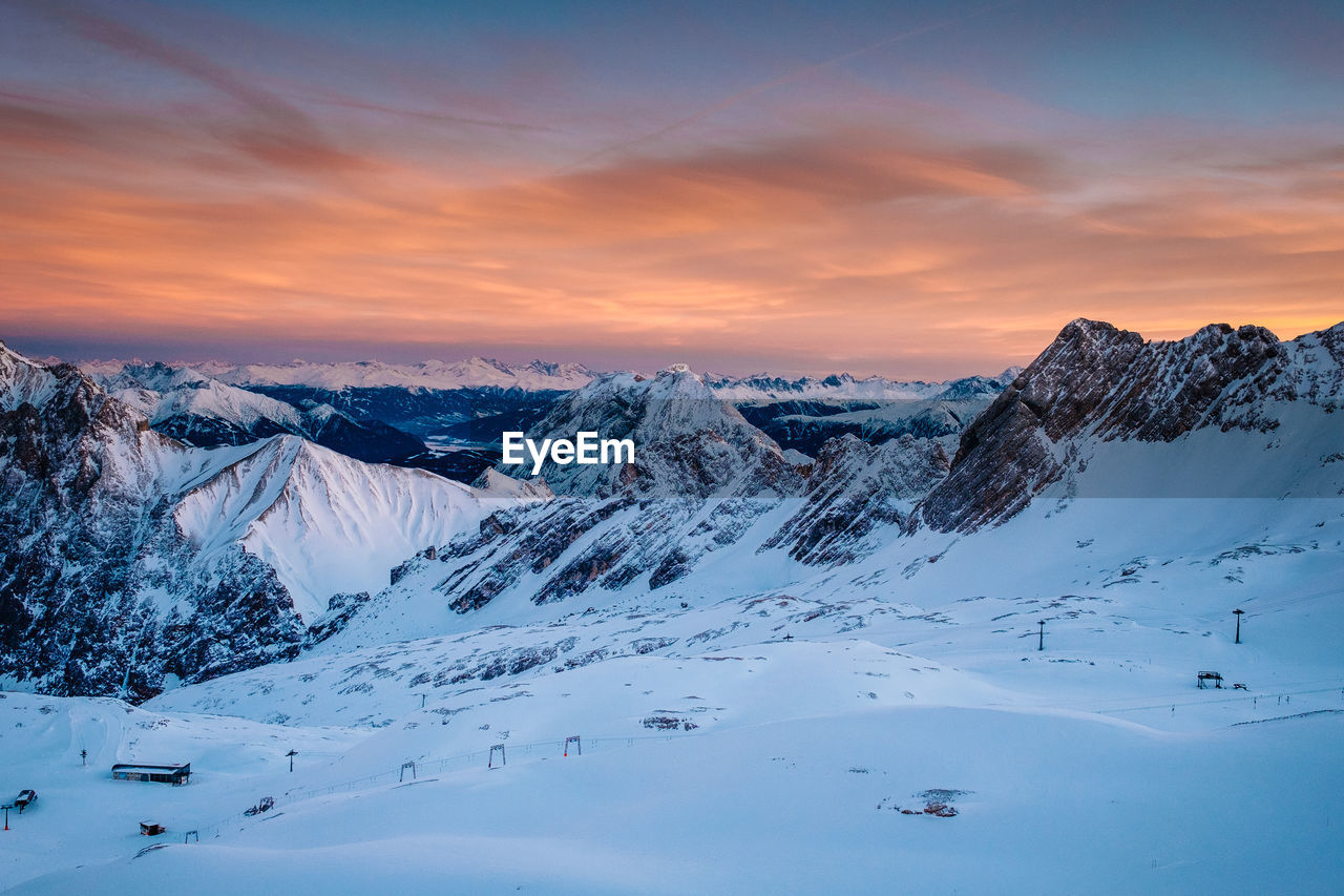 Scenic view of mountains against sky during sunset