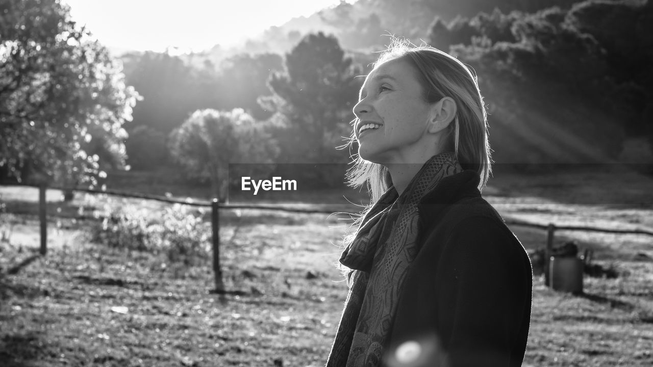 Nostalgic mid adult woman looking away