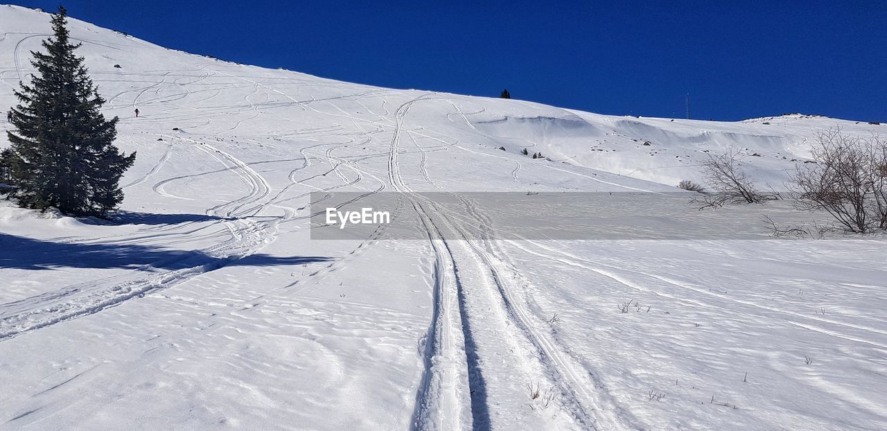 Snow covered mountain against sky