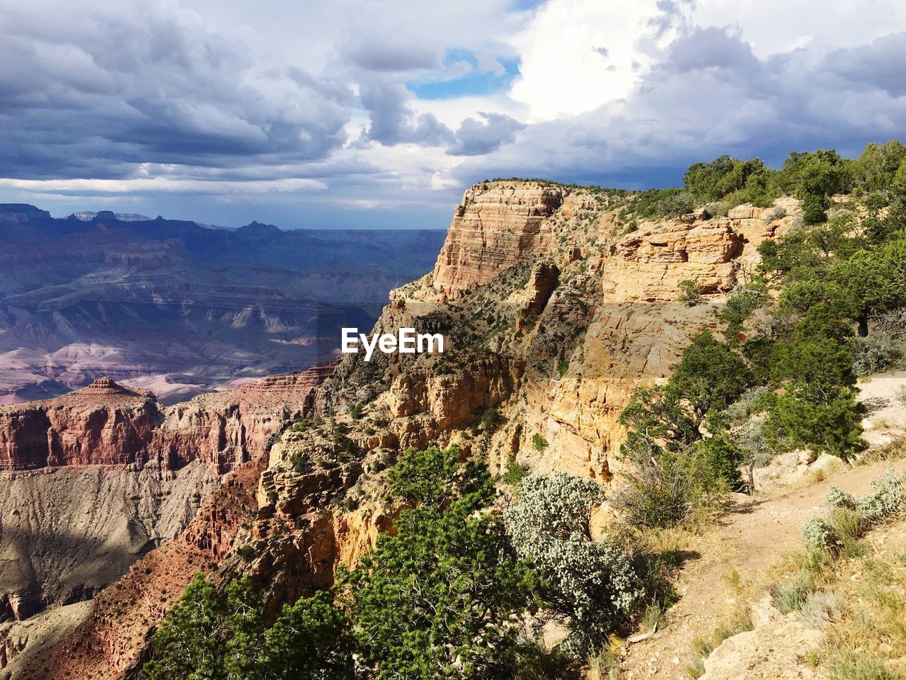 Scenic view of rock formations at grand canyon against sky