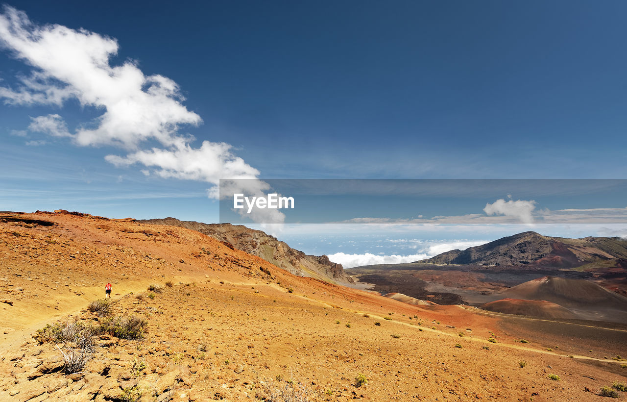 Wide volcanic landscape in different colors, wide view, ocher shades, trail, hawaii, maui, haleakala