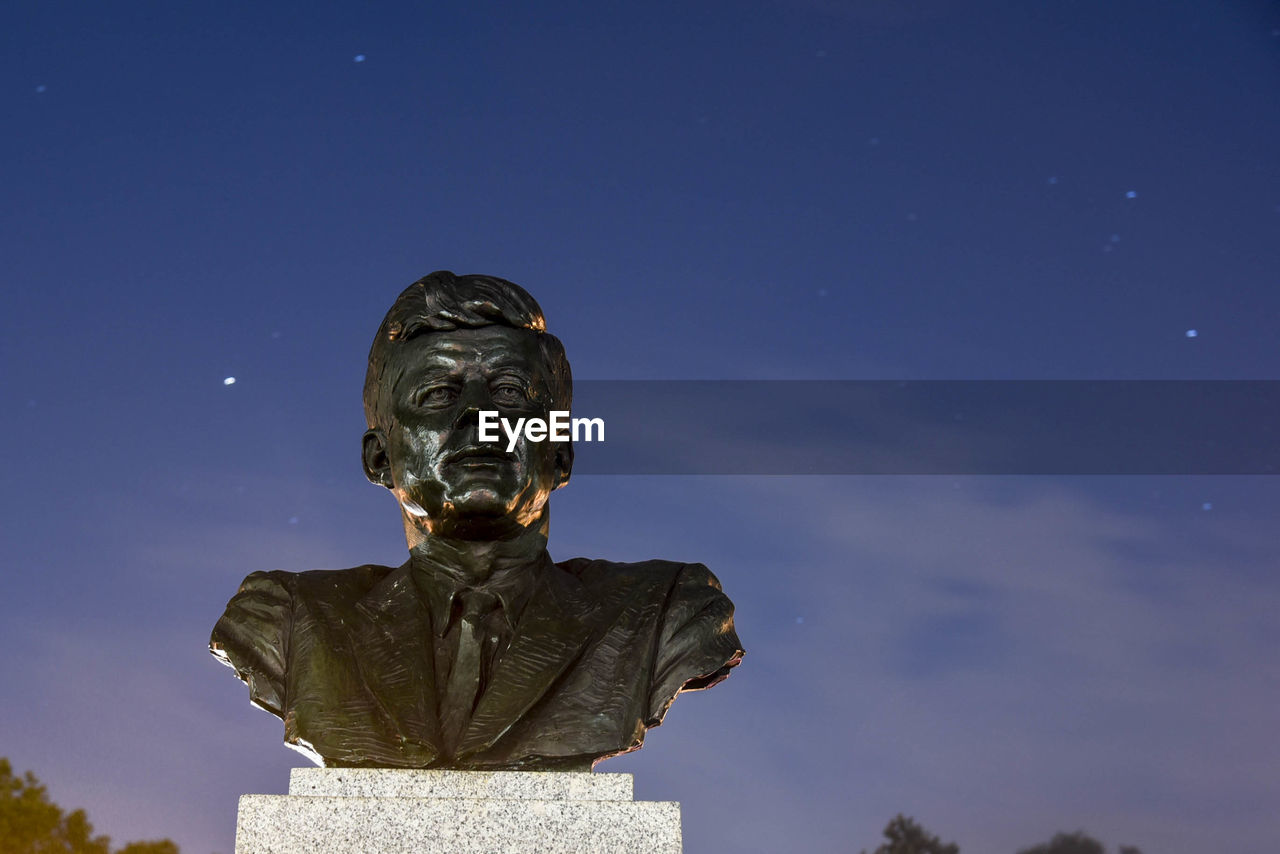 LOW ANGLE VIEW OF ANGEL STATUE AGAINST SKY