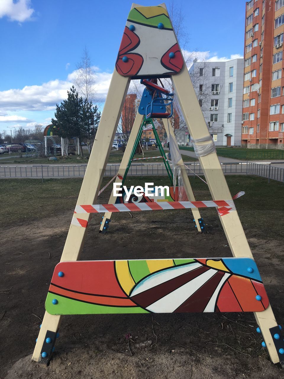 LOW ANGLE VIEW OF ROAD SIGN ON PLAYGROUND