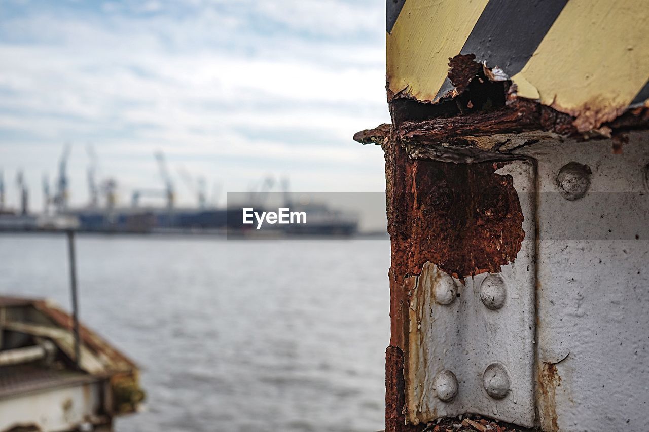 Close-up of rusty metal at commercial dock