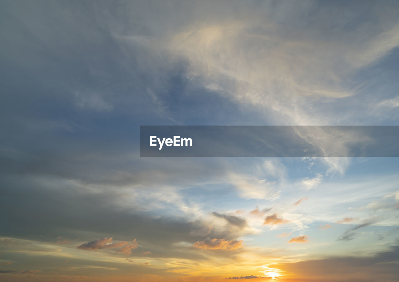 low angle view of cloudy sky during sunset