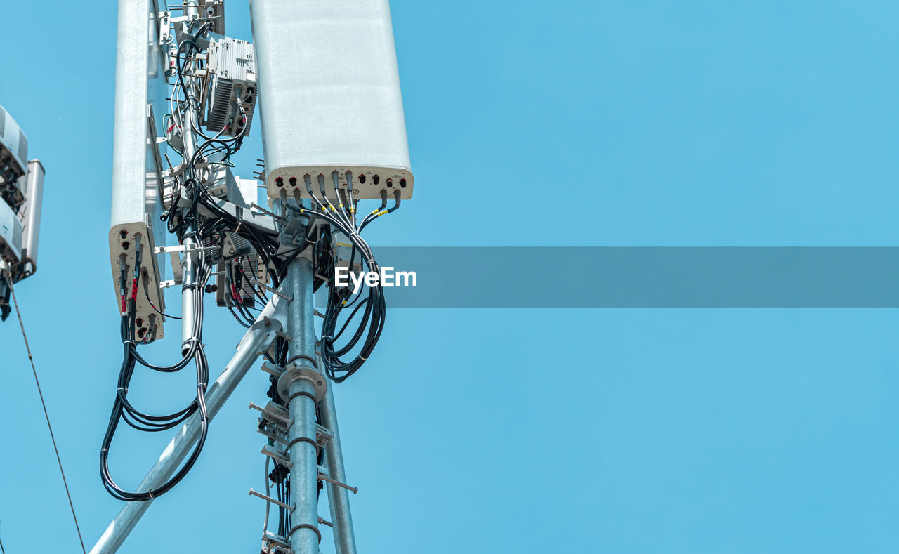 Telecommunication tower with clear blue sky background. the antenna against the blue sky. 