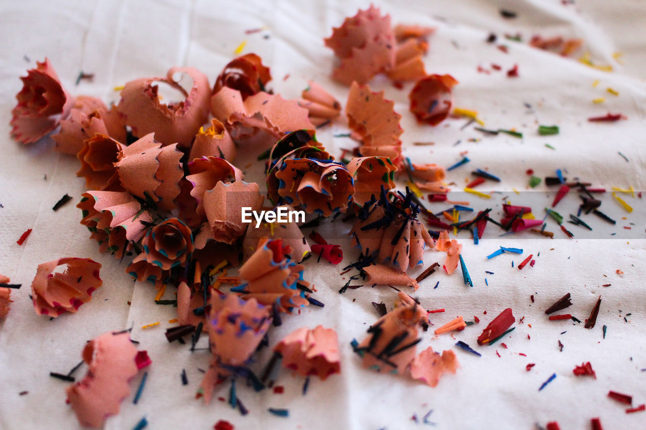 Close-up of pencil shavings on fabric