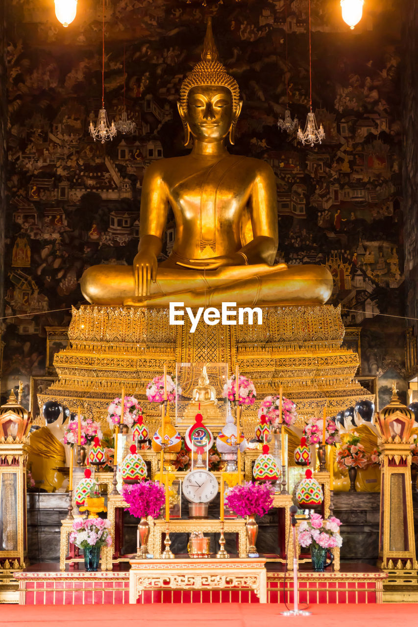 Low angle view of buddha statue in ancient temple