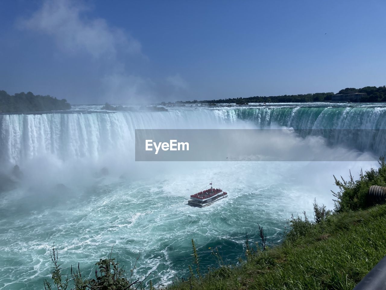 SCENIC VIEW OF WATERFALL IN SEA