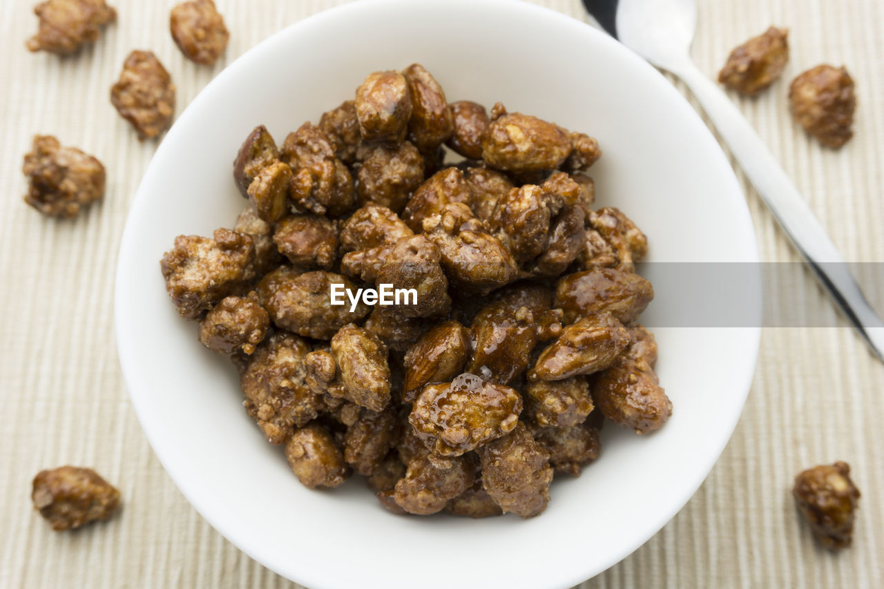 Close-up of roasted almonds in plate at table