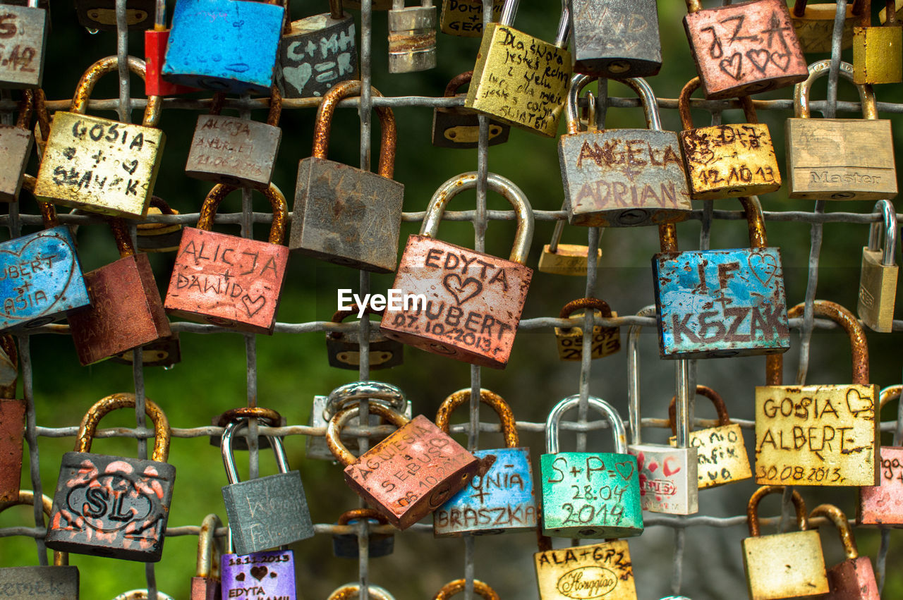 Close up view of padlocks attached to metal grate