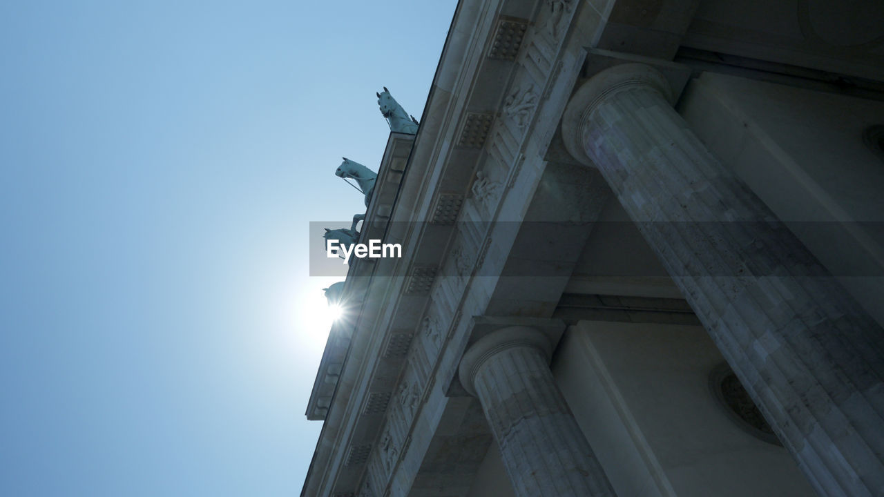 Low angle view of brandenburg gate against sky in city