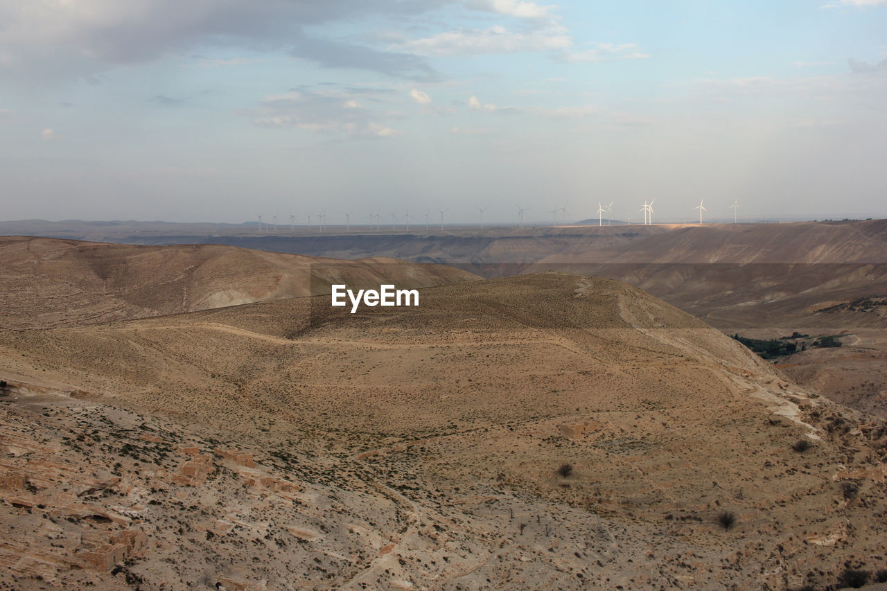 natural environment, environment, soil, landscape, sky, scenics - nature, land, nature, cloud, beauty in nature, geology, tranquility, hill, non-urban scene, no people, tranquil scene, day, plain, plateau, sand, desert, outdoors, climate, remote, arid climate, wadi, steppe, physical geography, horizon, industry