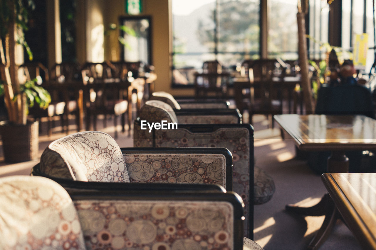 Tables and armchairs at restaurant