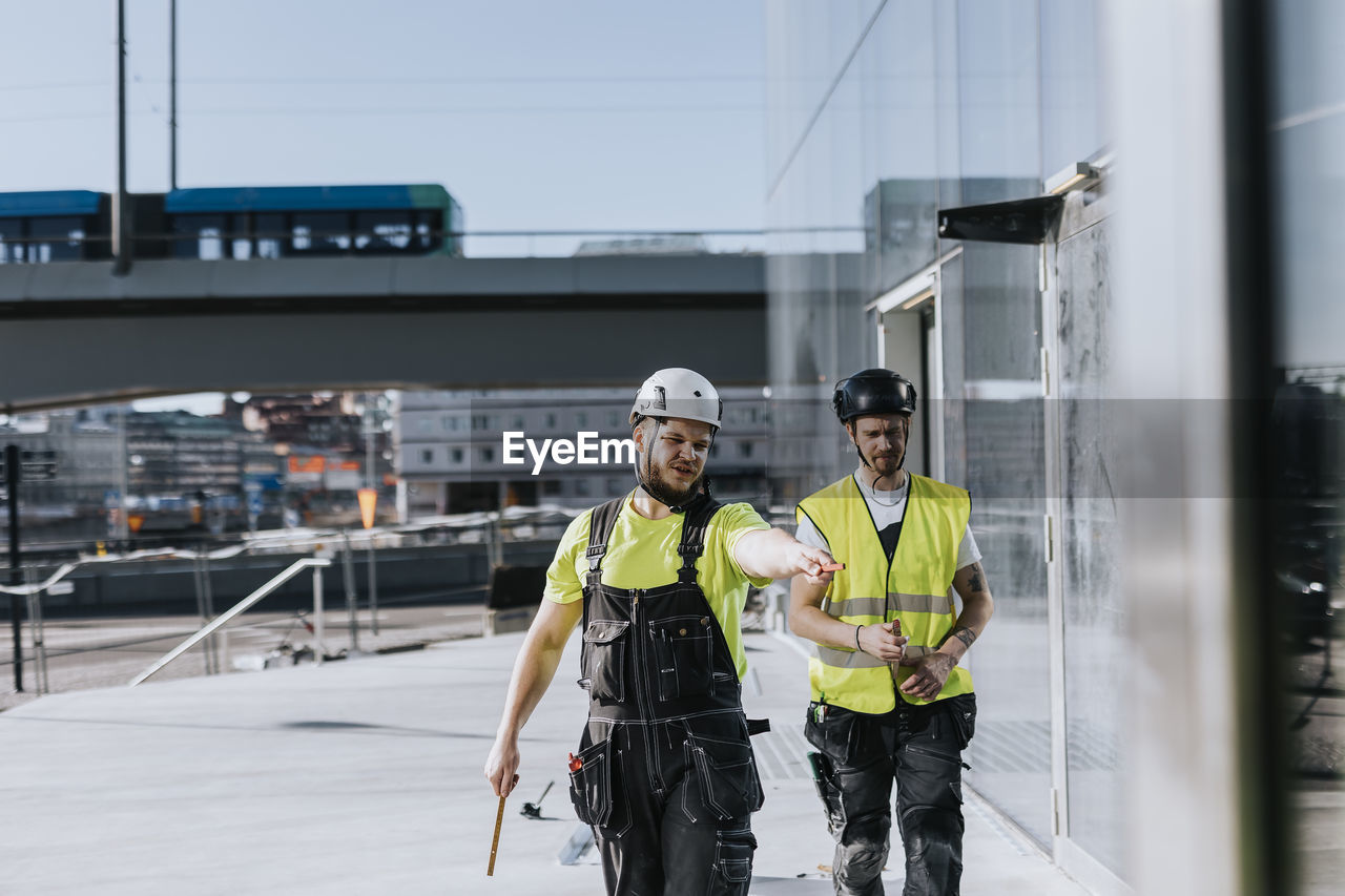 People talking at construction site