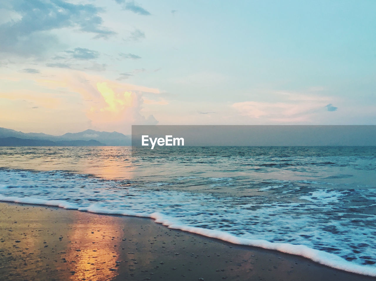 Scenic view of sea against sky during sunset