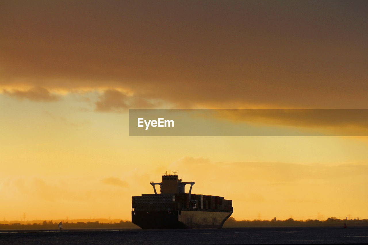 Container ship coming from the port of hamburg at willkomm höft in wedel