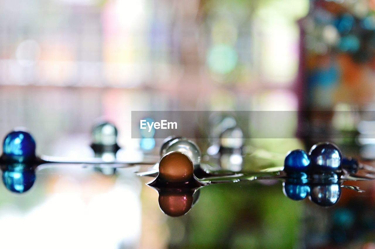 Close-up of wet marbles on table