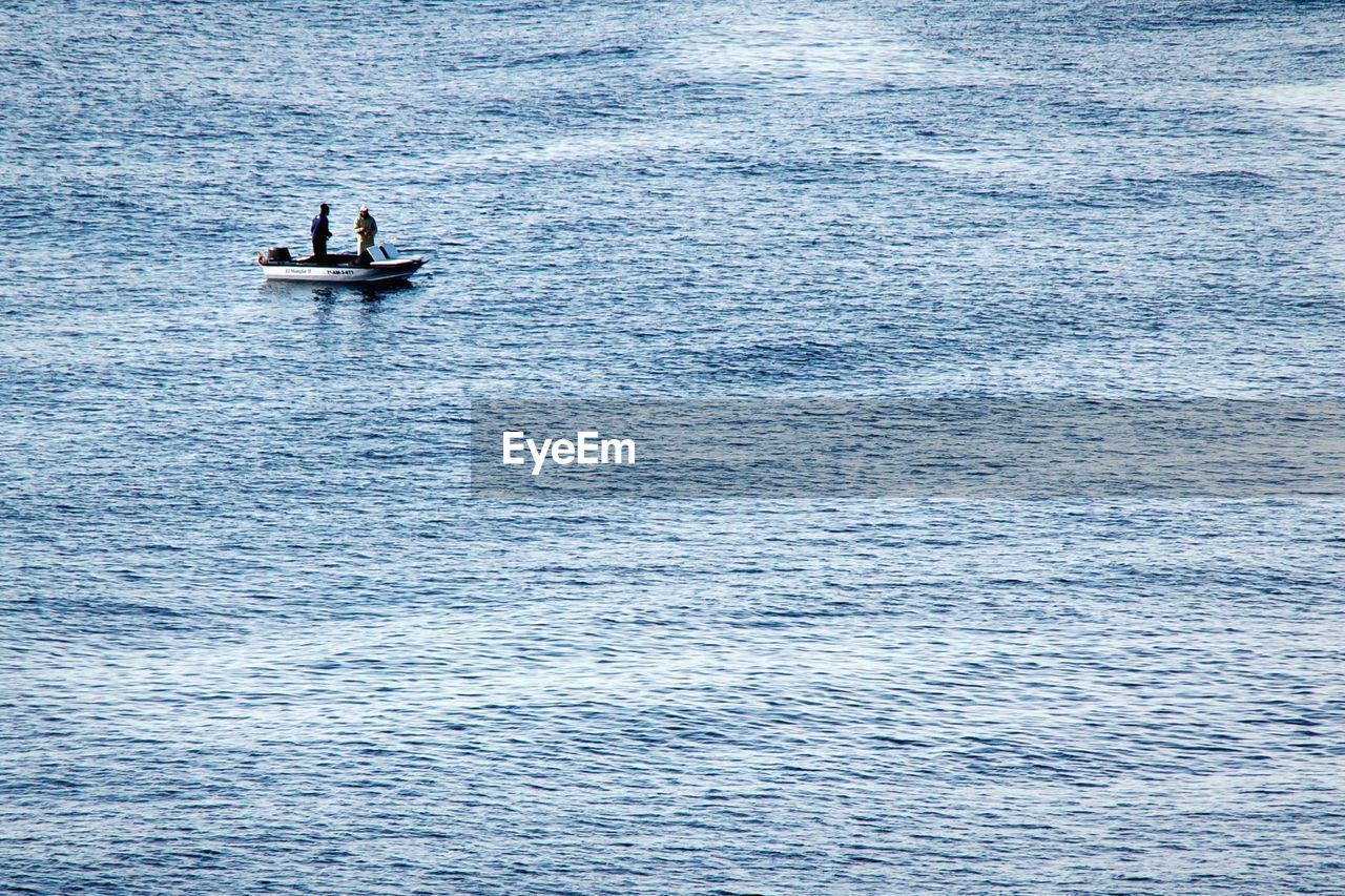 People fishing in sea