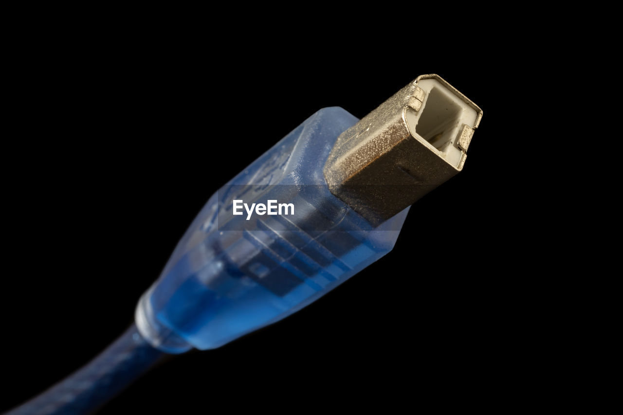 Close-up of cable against black background