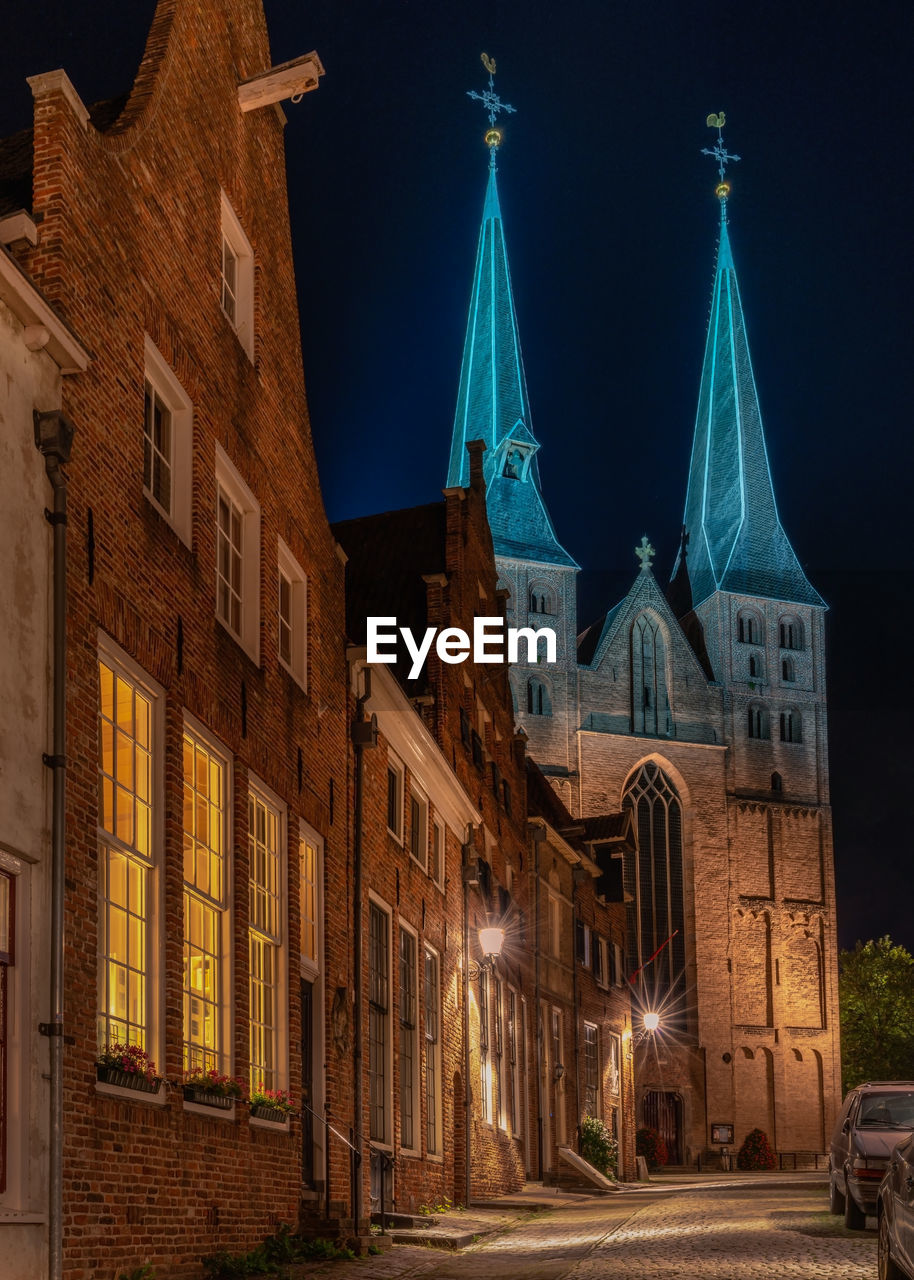 Illuminated church in city at night