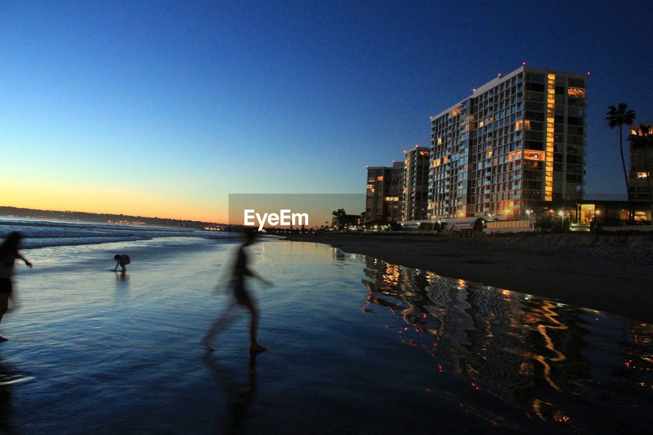 Tourist at beach during dusk