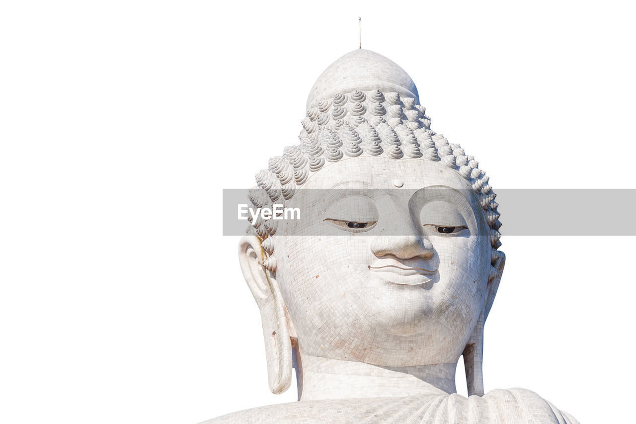 Low angle view of giant buddha statue against clear sky