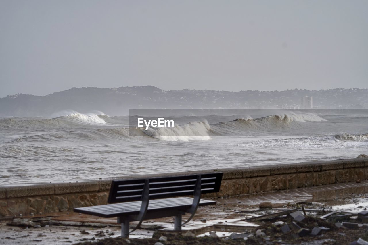 Scenic view of sea against storm sky