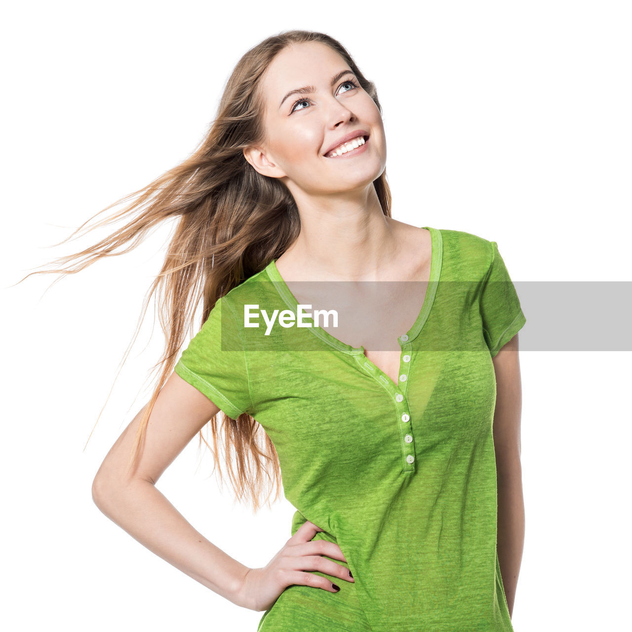 Smiling young woman against white background