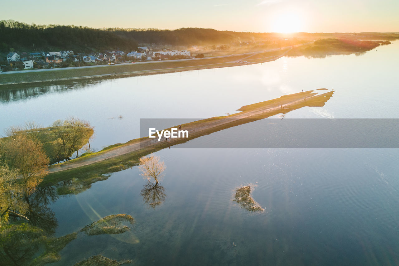 Scenic view of lake at sunset