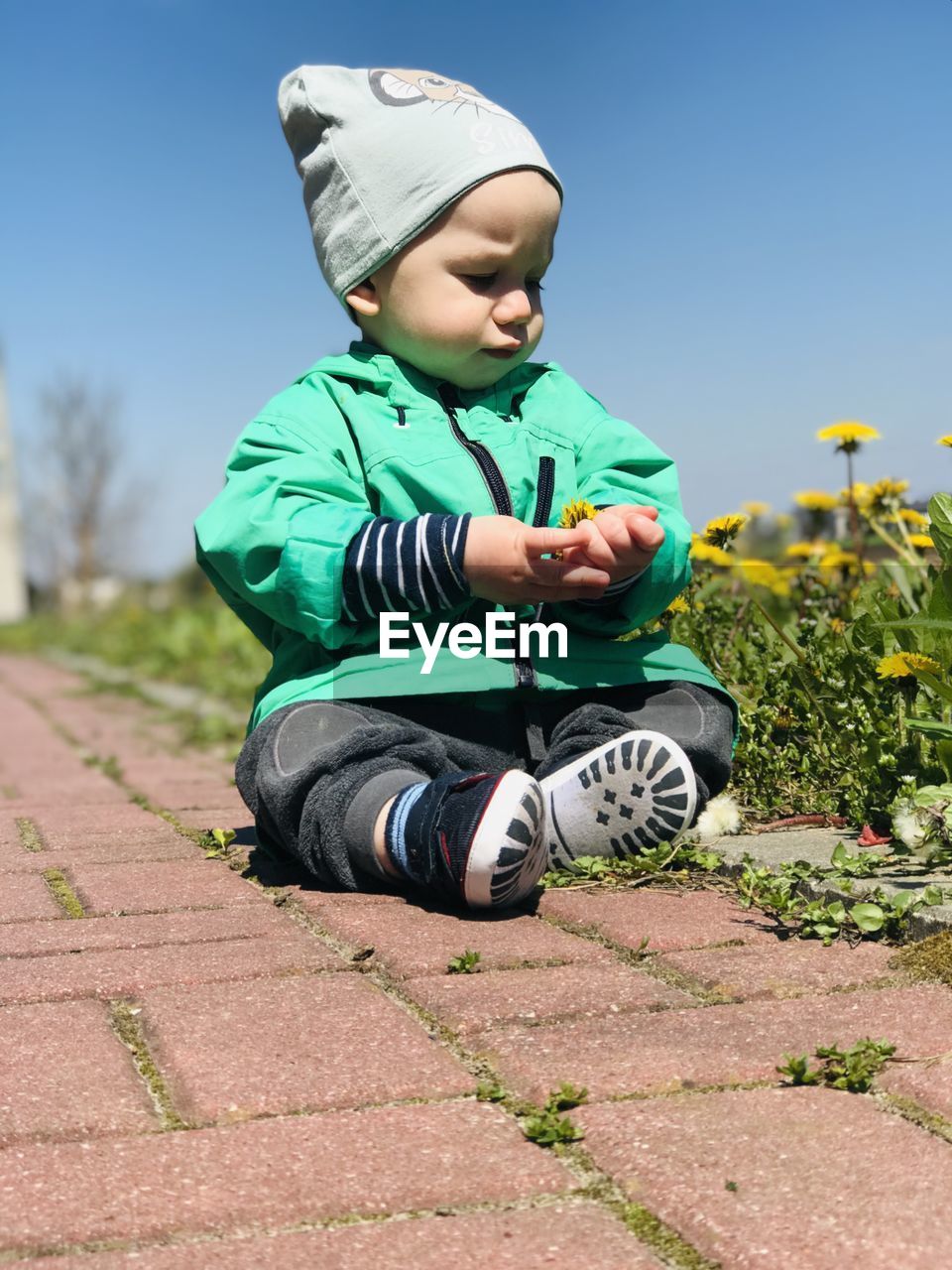 CUTE BOY WEARING HAT AGAINST SKY