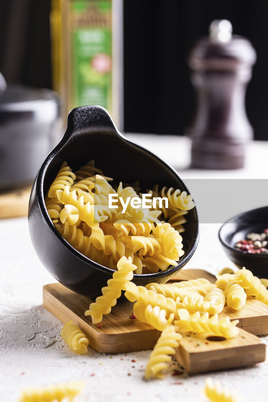 food, food and drink, dish, pasta, italian food, cuisine, healthy eating, freshness, indoors, yellow, vegetable, wellbeing, no people, kitchen utensil, meal, studio shot, still life, ingredient, produce