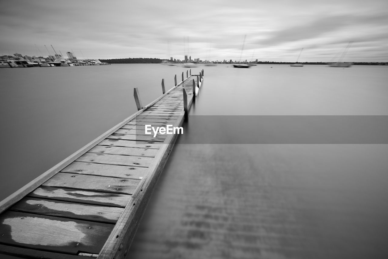 Pier over sea against sky