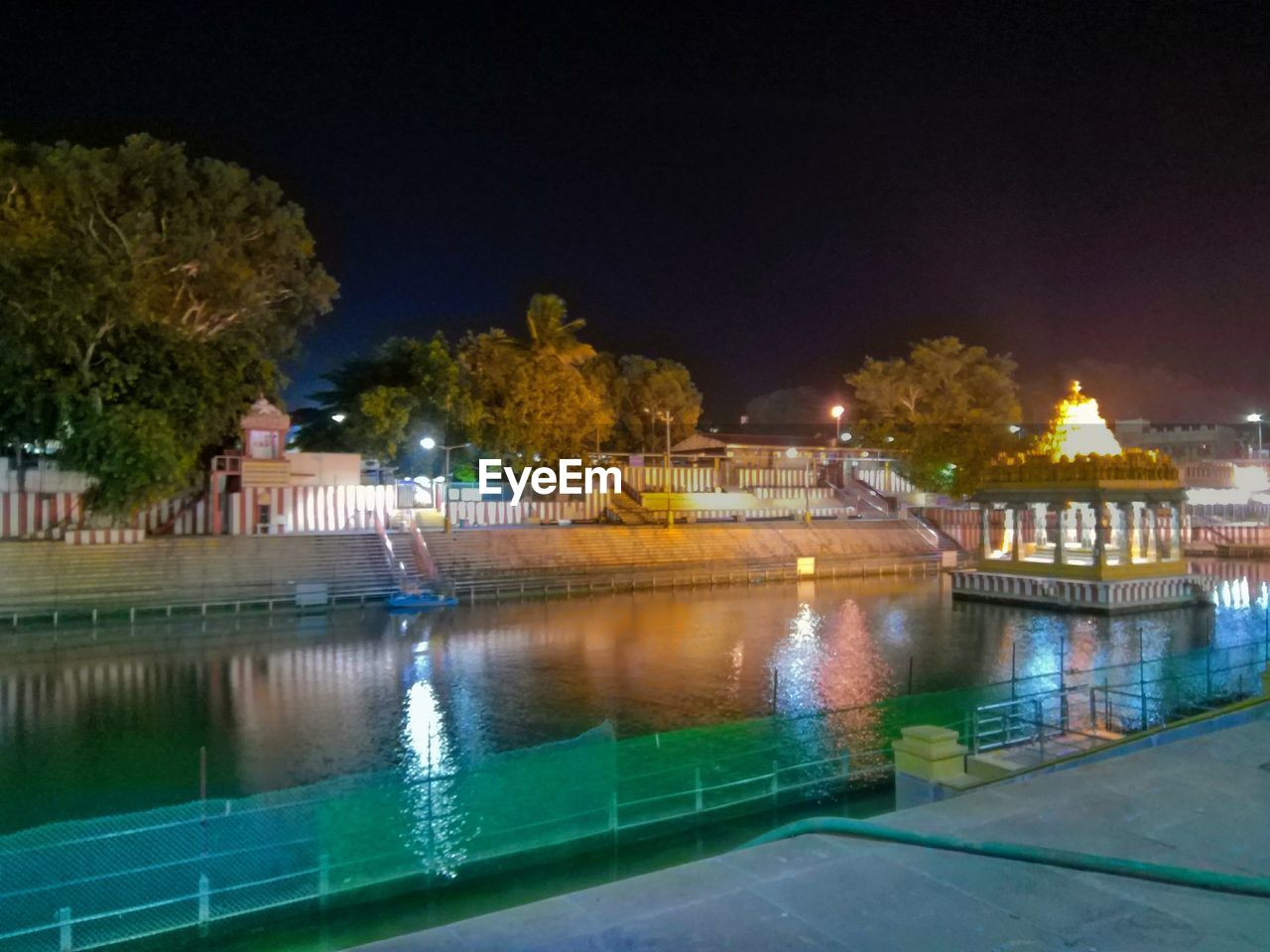 ILLUMINATED SWIMMING POOL AT NIGHT